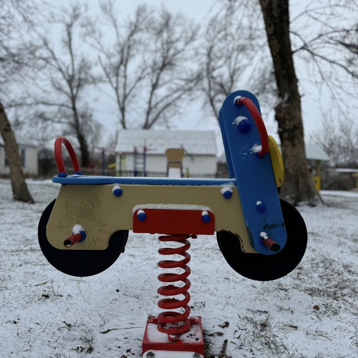 Spring rider shaped like a motorbike